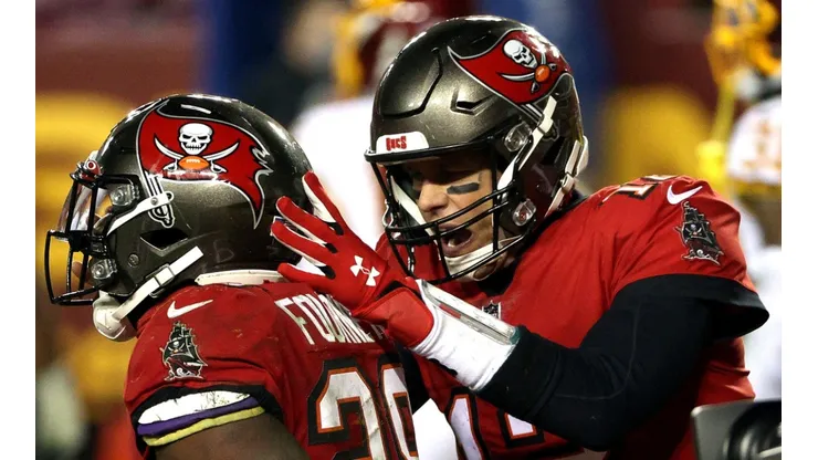 Leonard Fournette y Tom Brady