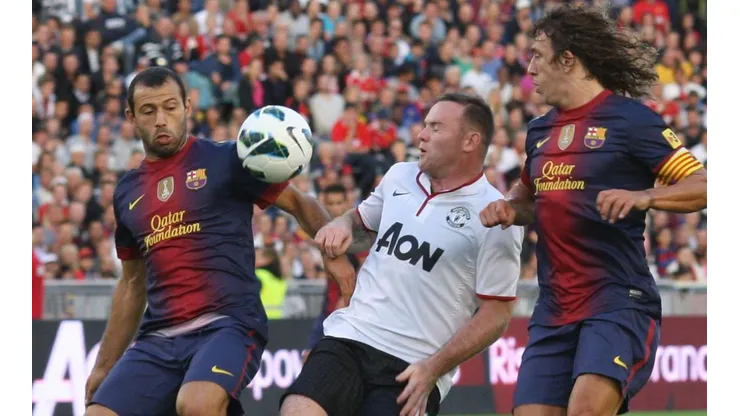 Javier Mascherano y Carles Puyol, juntos en Barcelona.