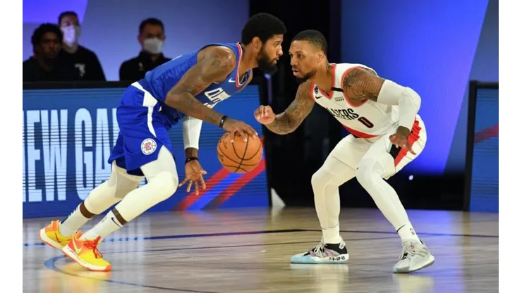 Paul George y Damian Lillard (Getty Images)