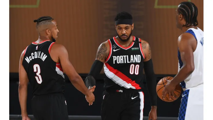 CJ McCollum con Carmelo Anthony (Getty)