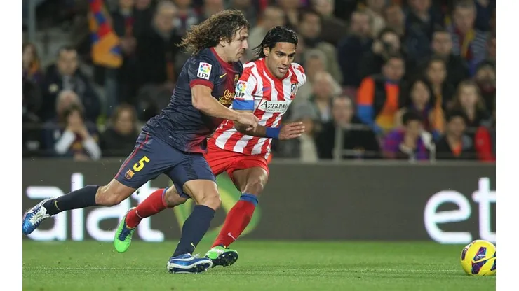 Carles Puyol y Radamel Falcao.