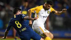 Néstor Ortigoza enfrentando a Boca Juniors.