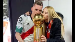 Foto de Franco Armani y su pareja disfrutando un título en River.