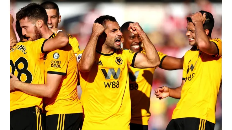 Foto de los jugadores celebrando un gol.