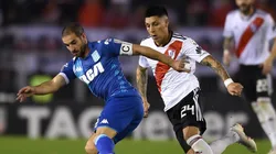 MANO A MANO. Lisandro López busca escaparse de la marca de Enzo Pérez (Foto: Getty).