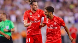 FESTEJO DE ROJOS. Bale y Asensio celebran el 1-0 de Real Madrid contra Roma.