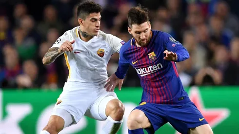 Foto de Diego Perotti junto a Lionel Messi.