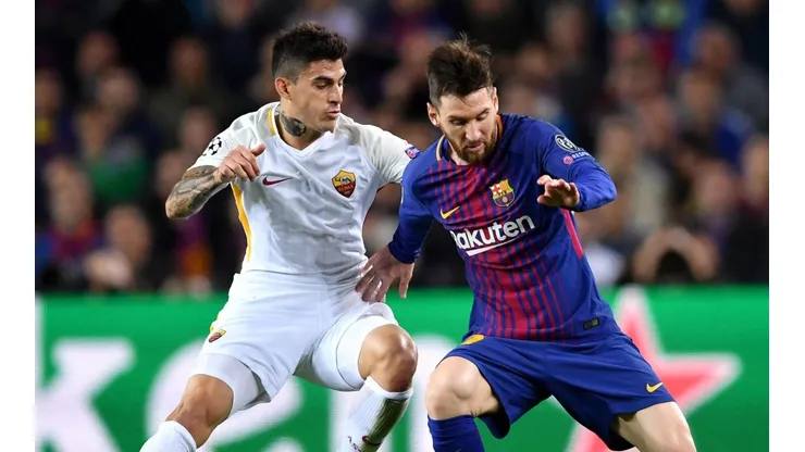 Foto de Diego Perotti junto a Lionel Messi.