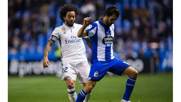 Arribas defiende el balón ante Marcelo.