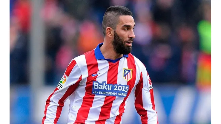 Turan con Atlético de Madrid.