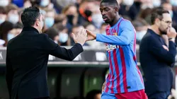 Ousmane Dembélé y Xavi Hernández.