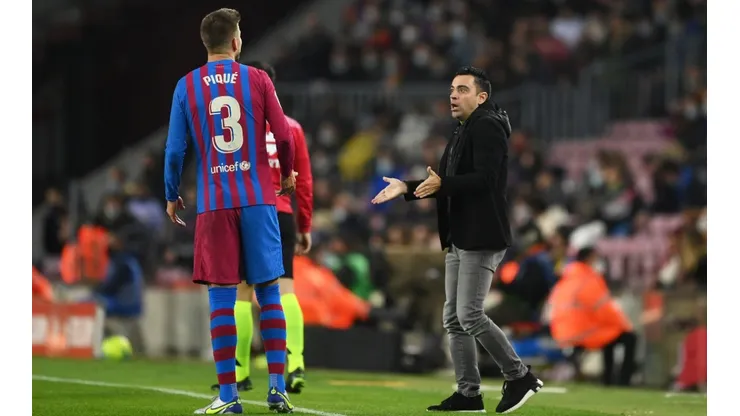 Xavi Hernández y Gerard Piqué en un encuentro del Barcelona.