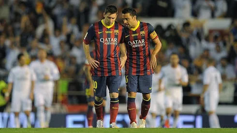 Messi y Xavi como compañeros en 2014.