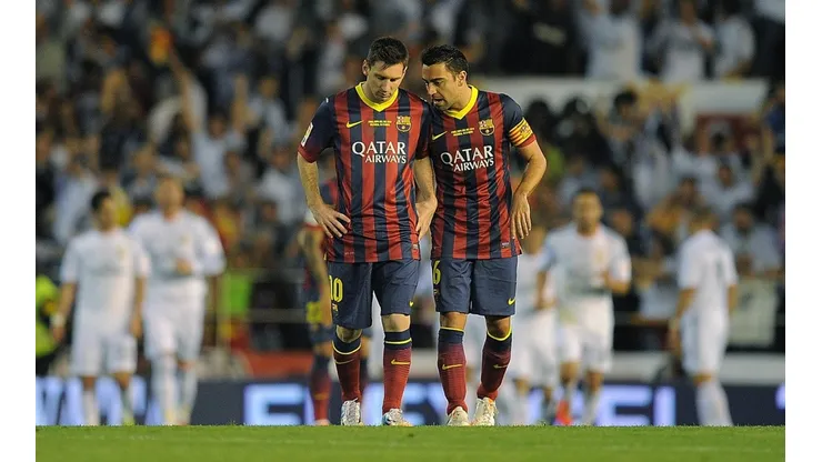 Messi y Xavi como compañeros en 2014.