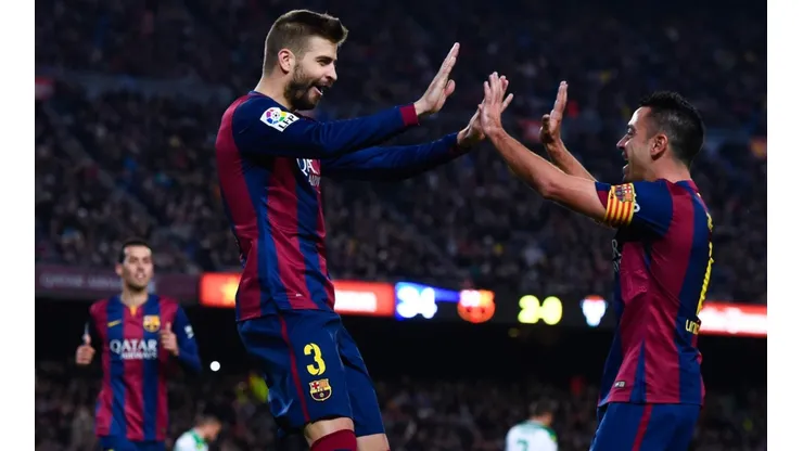 Gerard Piqué y Xavi Hernández en un encuentro con Barcelona.