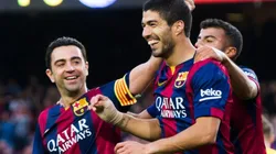Luis Suárez y Xavi Hernández, compañeros en Barcelona en 2015.