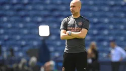 Pep Guardiola durante un encuentro con Manchester City.