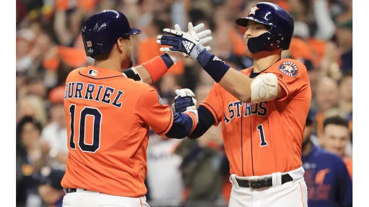 Yuli Gurriel y Carlos Correa