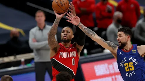 Damian Lillard superando a Austin Rivers