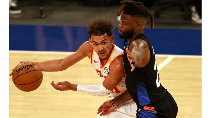 Trae Young y Reggie Bullock