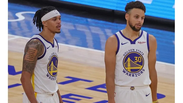 Damion Lee y Stephen Curry