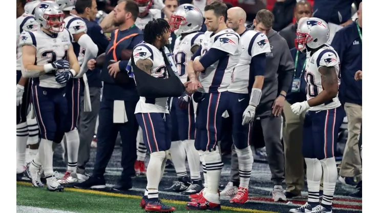 Patrick Chung y Tom Brady
