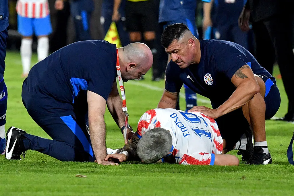 ASUNCION, PARAGUAY – JUNE 5: Julio Enciso of Paraguay lies injured and is being treated on the field by Paraguay medical staff members during the international friendly match between Paraguay and Nicaragua at the Defensores del Chaco Stadium on June 5, 2026 in Asuncion, Paraguay. (Photo by Christian Alvarenga /Getty Images)
