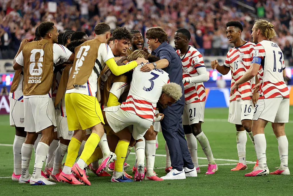 LOS ANGELES, CALIFORNIA – JUNE 12: Mauricio Pochettino, Head Coach of the United States, celebrates with Giovanni Reyna #7 of the United States and team mates after the team’s victory in the FIFA World Cup 2026 Group D match between USA and Paraguay at Los Angeles Stadium on June 12, 2026 in Los Angeles, California. (Photo by Jamie Squire/Getty Images)