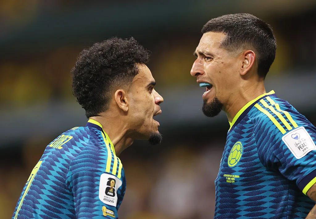 MEXICO CITY, MEXICO - JUNE 17: Daniel Munoz #2 of Colombia celebrates with teammate Luis Diaz #7 after scoring his team's first goal during the FIFA World Cup 2026 Group K match between Uzbekistan and Colombia at Mexico City Stadium on June 17, 2026 in Mexico City, Mexico. (Photo by Carl Recine/Getty Images)