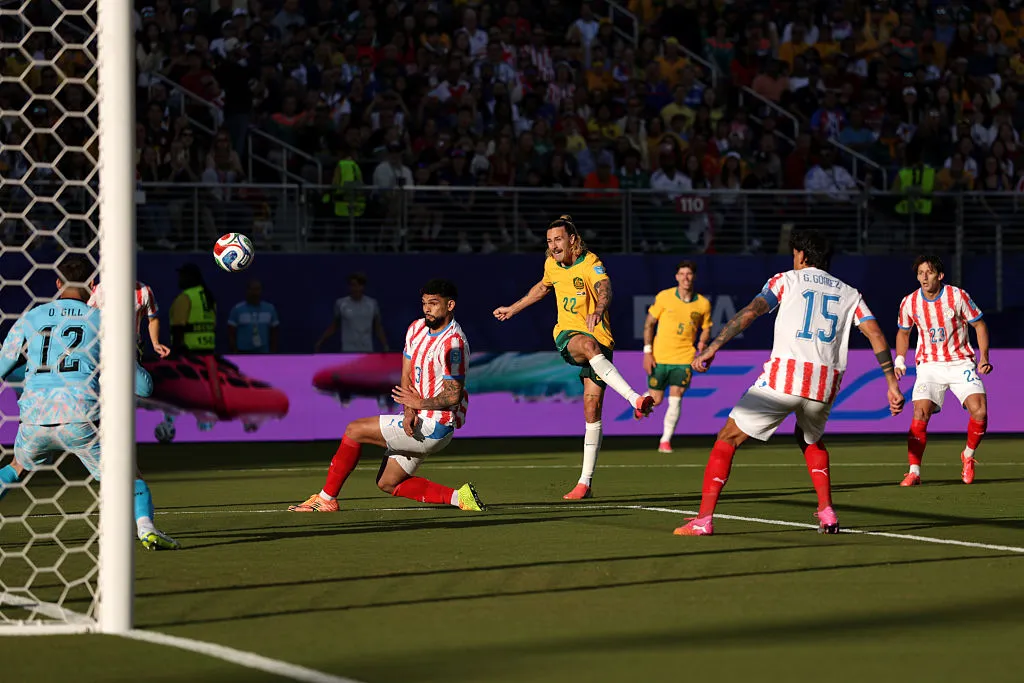 SANTA CLARA, CALIFORNIA – JUNE 25: Jackson Irvine #22 of Australia shoots and misses a chance against Omar Alderete #3 of Paraguay during the FIFA World Cup 2026 Group D match between Paraguay and Australia at San Francisco Bay Area Stadium on June 25, 2026 in Santa Clara, California. (Photo by Stu Forster/Getty Images)