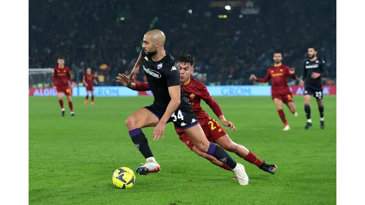 ROME, ITALY - JANUARY 15: Sofyan Amrabat of ACF Fiorentina is challenged by Paulo Dybala of AS Roma during the Serie A match between AS Roma and ACF Fiorentina at Stadio Olimpico on January 15, 2023 in Rome, Italy. (Photo by Paolo Bruno/Getty Images)
