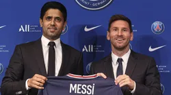 PARIS, FRANCE - AUGUST 11: Lionel Messi poses with his jersey next to President Nasser Al Khelaifi after the press conference of Paris Saint-Germain at Parc des Princes on August 11, 2021 in Paris, France. (Photo by Sebastien Muylaert/Getty Images)