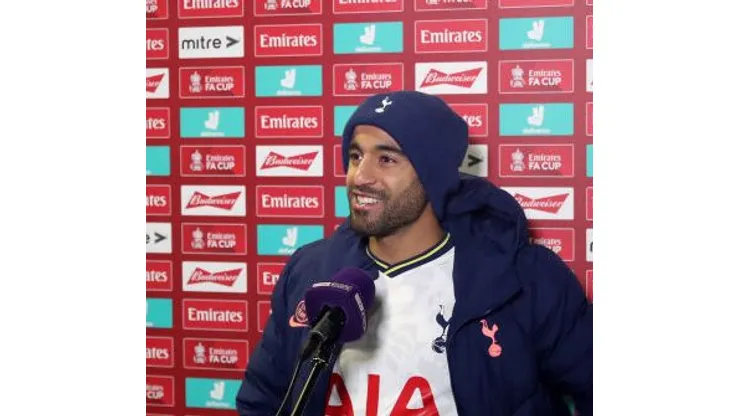 CROSBY, ENGLAND - JANUARY 10: Lucas Moura of Tottenham Hotspur speaks to the media as he is interviewed pitch side after the FA Cup Third Round match between Marine and Tottenham Hotspur at Rossett Park on January 10, 2021 in Crosby, England. Sporting stadiums around England remain under strict restrictions due to the Coronavirus Pandemic as Government social distancing laws prohibit fans inside venues resulting in games being played behind closed doors. (Photo by Clive Brunskill/Getty Images)