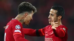 LIVERPOOL, ENGLAND - APRIL 13: Roberto Firmino of Liverpool celebrates with Thiago Alcantara after scoring their team's third goal during the UEFA Champions League Quarter Final Leg Two match between Liverpool FC and SL Benfica at Anfield on April 13, 2022 in Liverpool, England. (Photo by Clive Brunskill/Getty Images)