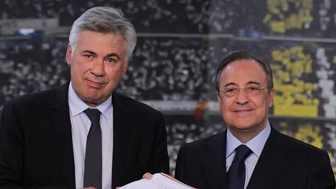 MADRID, SPAIN - JUNE 26: Carlo Ancelotti (L) holds up a Real Madrid shirt as he stands alongside club president Florentino Perez while being presented as Real Madrid's new head coach at Estadio Bernabeu on June 26, 2013 in Madrid, Spain. (Photo by Denis Doyle/Getty Images)