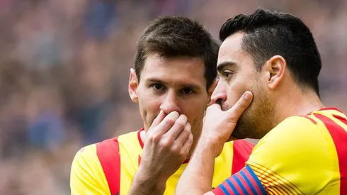 BARCELONA, SPAIN - MARCH 29: Lionel Messi (L) and Xavi Hernandez of FC Barcelona speak during the La Liga match between RCD Espanyol and FC Barcelona at Cornella-El Prat Stadium on March 29, 2014 in Barcelona, Spain. (Photo by Alex Caparros/Getty Images)