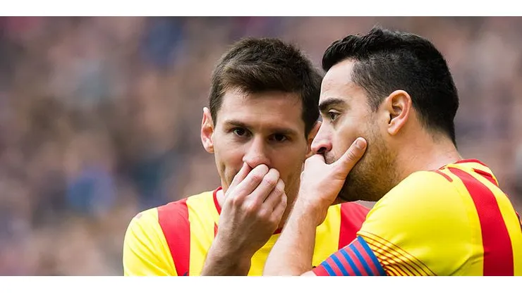 BARCELONA, SPAIN - MARCH 29: Lionel Messi (L) and Xavi Hernandez of FC Barcelona speak during the La Liga match between RCD Espanyol and FC Barcelona at Cornella-El Prat Stadium on March 29, 2014 in Barcelona, Spain. (Photo by Alex Caparros/Getty Images)