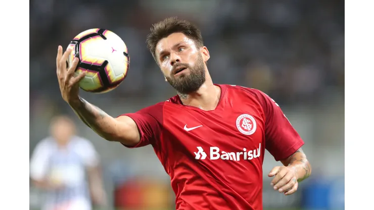 LIMA, PERU - APRIL 24: Rafael Sobis of SC Internacional grabs the ball during a group A match between Alianza Lima and SC Internacional as part of Copa CONMEBOL Libertadores 2019 at Estadio Nacional de Lima on April 24, 2019 in Lima, Peru. (Photo by Raul Sifuentes/Getty Images)