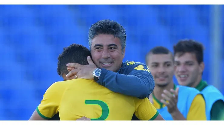 AVIGNON, FRANCE - JUNE 01: Head Coach Alexandre Gallo of Brazil hugs Marquinhos after he scores their third goal during the Final of the Toulon Tournament between France and Brazil at the Parc des Sports Avignon on June 1, 2014 in Avignon, France. (Photo by Christopher Lee/Getty Images)