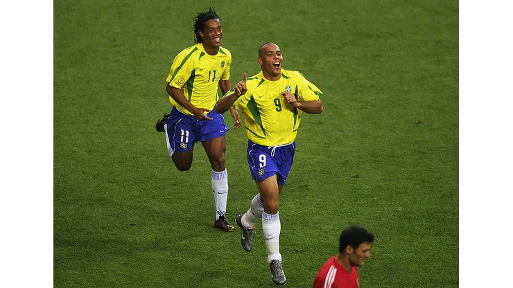 ULSAN - JUNE 3: Ronaldo (left) of Brazil celebrates scoring the equalising goal against Turkey with team mate Ronaldinho during the Group C match of the World Cup Group Stage played at the Ulsan-Munsu World Cup Stadium, Ulsan, South Korea on June 3, 2002. Brazil won the match 2-1. (Photo by Clive Brunskill/Getty Images)