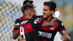 RIO DE JANEIRO, BRAZIL - JULY 08: Pedro of Flamengo celebrates with his teammates Gabriel Barbosa and Bruno Henrique after scoring the first goal of his team during the match between Flamengo and Fluminense as part of the Taca Rio, the Second Leg of the Carioca State Championship at Maracana Stadium on July 8, 2020 in Rio de Janeiro, Brazil. The match is played behind closed doors and further precautionary measures against the coronavirus (COVID - 19) Pandemic. (Photo by Buda Mendes/Getty Images)