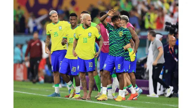 DOHA, QATAR - DECEMBER 05: Vinicius Junior, Neymar and Fred of Brazil acknowledge the fans after the team's victory during the FIFA World Cup Qatar 2022 Round of 16 match between Brazil and South Korea at Stadium 974 on December 05, 2022 in Doha, Qatar. (Photo by Buda Mendes/Getty Images)