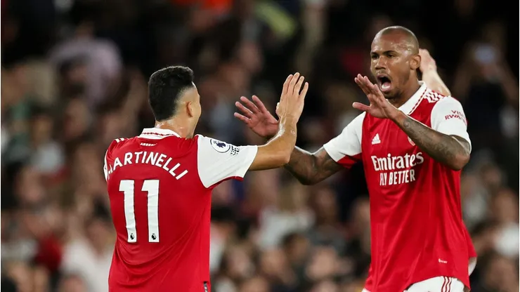 Gabriel Martinelli celebrates with Gabriel Magalhaes of Arsenal after the final whistle of the Premier League match between Arsenal FC and Aston Villa at Emirates Stadium on August 31, 2022 in London, England. (Photo by David Rogers/Getty Images)