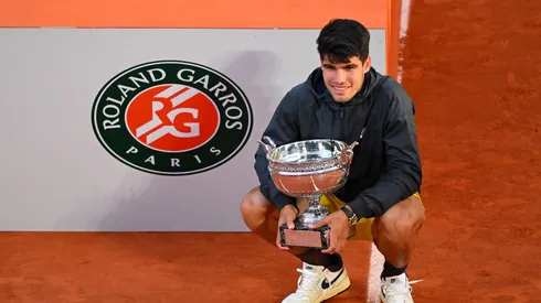 PARIS, FRANCE - JUNE 09: Carlos Alcaraz of Spain celebrates with the winners trophy after victory in the Men's Singles Final match between Alexander Zverev of Germany and Carlos Alcaraz of Spain on Day 15 of the 2024 French Open at Roland Garros on June 09, 2024 in Paris, France. (Photo by Tim Goode/Getty Images)