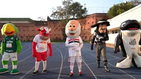 Mascotes se preparam para prova dos 100m rasos — Foto: Globo Esporte