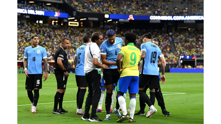 LAS VEGAS, NEVADA - JULY 06: Ronald Araujo of Uruguay leaves the pitch after suffering an injury during the CONMEBOL Copa America 2024 quarter-final match between Uruguay and Brazil at Allegiant Stadium on July 06, 2024 in Las Vegas, Nevada. (Photo by Candice Ward/Getty Images)