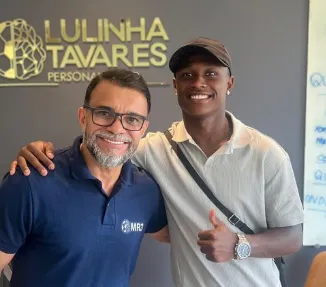 Foto de Nathan Fernandes com o preparador mental Lulinha Tavares.