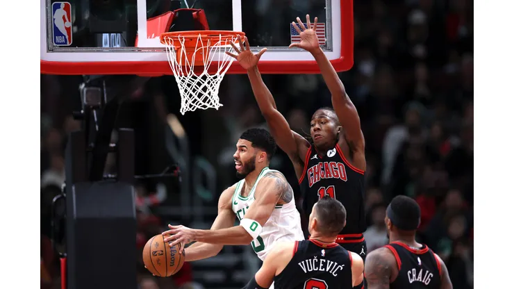 CHICAGO, ILLINOIS - NOVEMBER 29: Jayson Tatum #0 of the Boston Celtics looks to shoot the ball against Ayo Dosunmu #11 of the Chicago Bulls during the third quarter of the Emirates NBA Cup game at the United Center on November 29, 2024 in Chicago, Illinois. NOTE TO USER: User expressly acknowledges and agrees that, by downloading and or using this photograph, User is consenting to the terms and conditions of the Getty Images License Agreement. (Photo by Luke Hales/Getty Images)