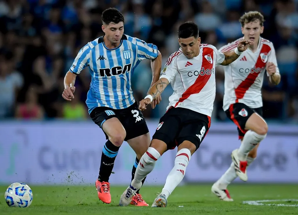 AVELLANEDA, ARGENTINA – DECEMBER 14: Maximiliano Meza (C) of River Plate competes for the ball against Juan Ignacio Nardoni (L) of Racing Club during a Liga Profesional 2024 match between Racing Club and River Plate at Presidente Peron Stadium on December 14, 2024 in Avellaneda, Argentina. (Photo by Marcelo Endelli/Getty Images)