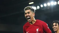 LIVERPOOL, ENGLAND - MARCH 05: Roberto Firmino of Liverpool celebrates after scoring the team's seventh goal with teammate Trent Alexander-Arnold during the Premier League match between Liverpool FC and Manchester United at Anfield on March 05, 2023 in Liverpool, England. (Photo by Michael Regan/Getty Images)